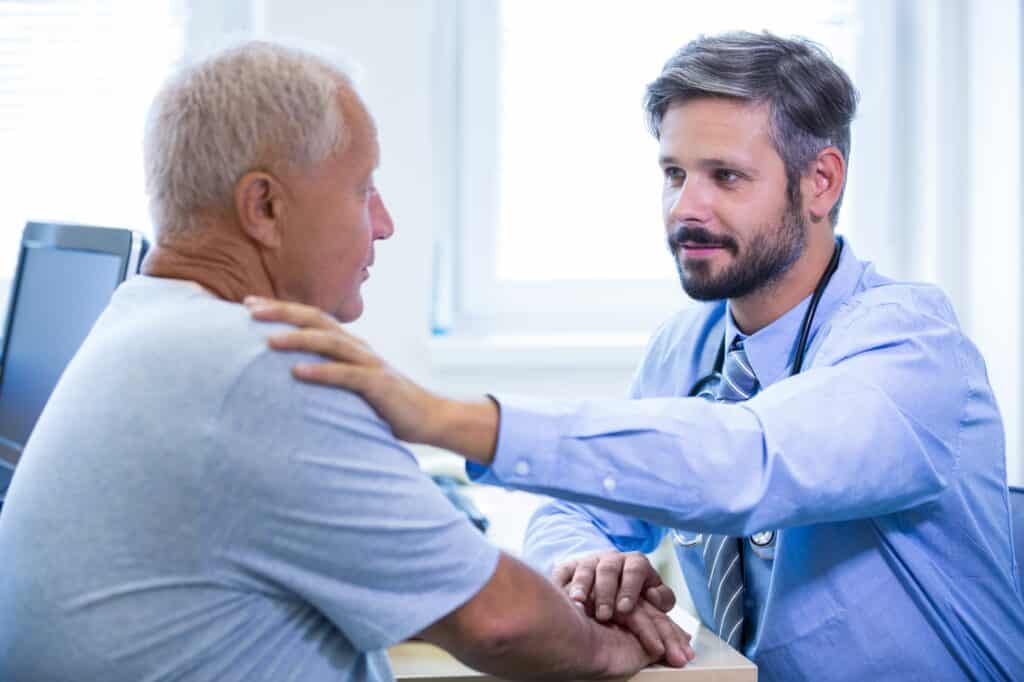 male-doctor-examining-patient-Fibromyalgia Treatment in Milford